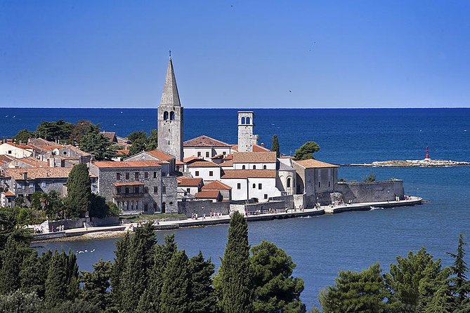Day trip to Poreč and Pula with lunch from Rovinj - Pula Amphitheatre: Roman Power With a View of the Sea