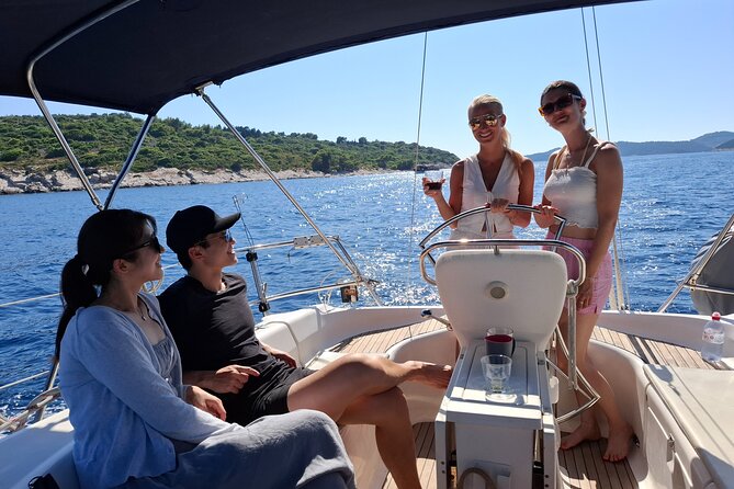 Dubrovnik: Full Day Private Sail Boat tour to Elaphiti&Blue Cave - Lopud and Sunj Beach: sandy shore, rocks, and beach club drinks