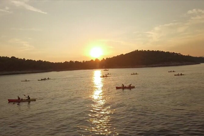 Dubrovnik: Sunset Kayaking & Snorkeling with water &wine - Kayaking the coast toward Lokrum: the view you can’t get from land