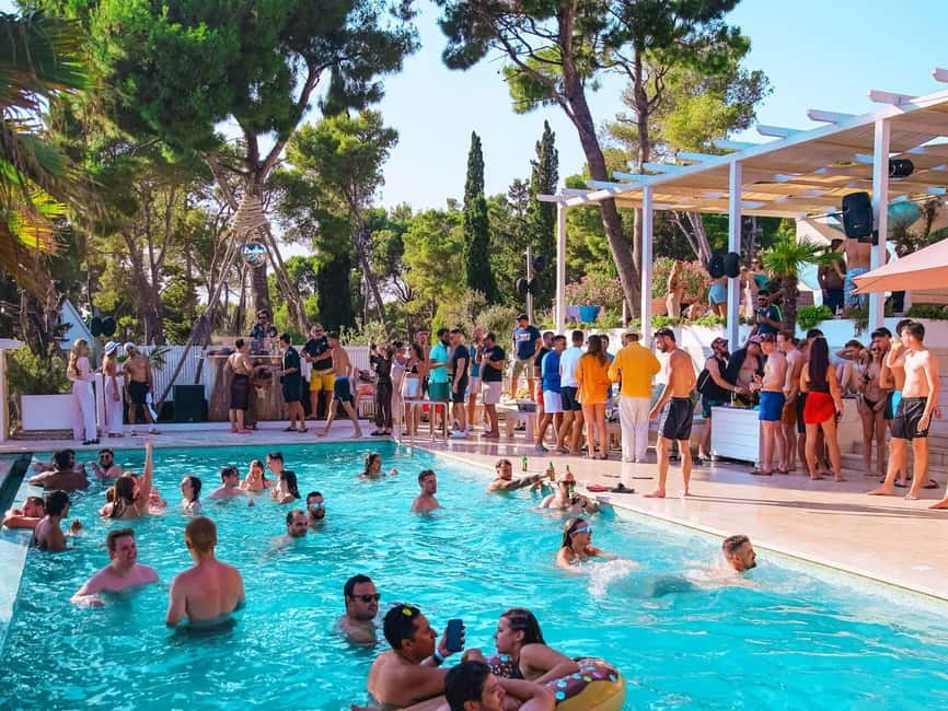 From Split: Brač Island Beach Bar and Pool Party - The beach bar resort setup: sunbeds, cabanas, and real swim time