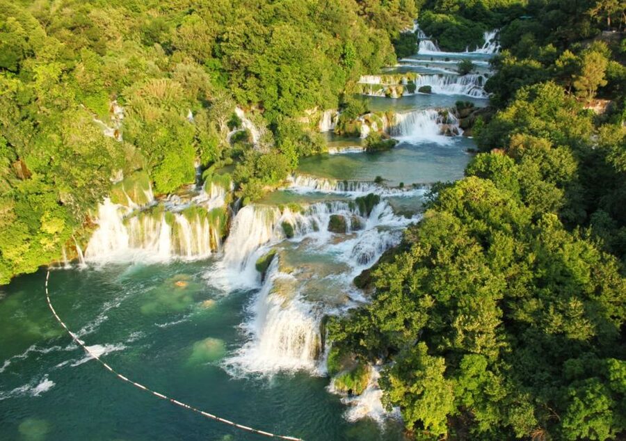 From Split: Krka Waterfalls Cruise & Trogir Walking Tour - Trogir walking tour: medieval walls, bell towers, and a UNESCO city-museum