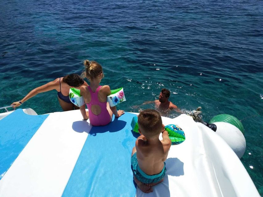 From Split: Luxury Cabin Boat Tour to The Blue Cave and Hvar - Stiniva cove cliffs and the dolphin-spotting gamble