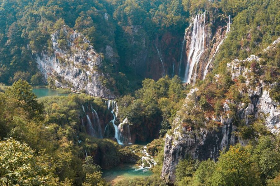 From Split or Trogir: Plitvice Lakes Guided Full-Day Tour - Inside Plitvice: Wooden Walkways and Where the Korana Makes the Waterfalls