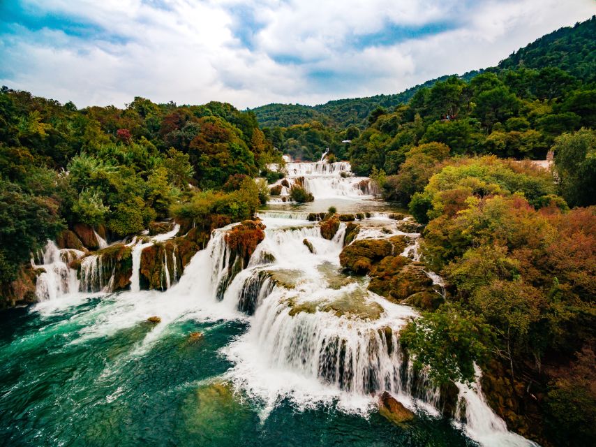 From Split & Trogir: Krka Waterfalls Day Tour with Boat Ride - Renovated Stone Houses and the Watermill Moment