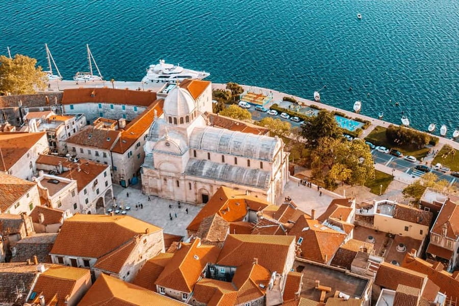 From Trogir, Seget & Okrug: Krka Waterfalls Culture Tour - Primošten: the seaside finish where the pace slows down