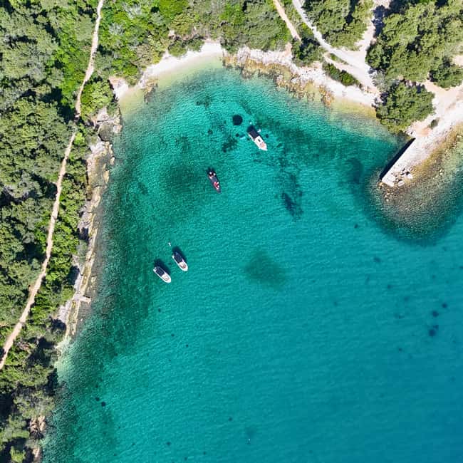 From Zadar: Island-Hopping Speedboat Tour with Drinks - Preko Town and Beach: Where the Day Often Becomes Relaxing