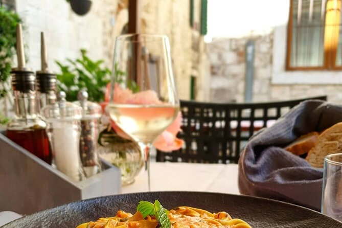Gastro and History Jewels Experience in Split - Seafood in Split: brodetto, squid ink, and fish-forward flavor
