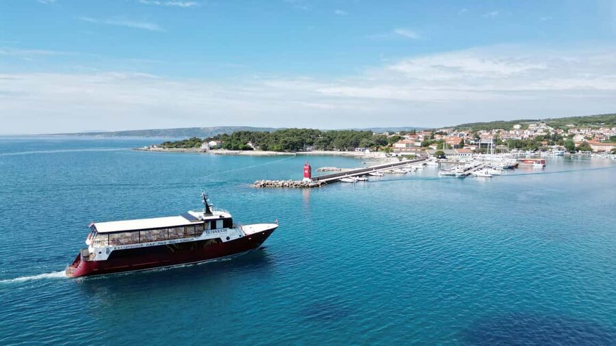 Krk:Rab & Pag Boat Trip with Swimming & City Tour with lunch - Krk coastline views from the boat: photos without the hassle