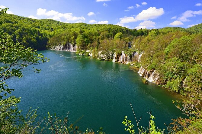 Plitvice Lakes Day Tour from Rijeka, Simple & Safe - Boat ride and panoramic train: how you see the falls without suffering