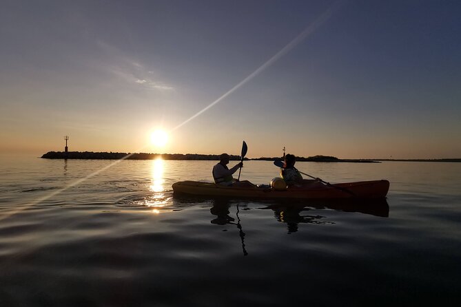 Poreč sunset sea kayaking tour - The kayak setup: sit-on-top, dry barrel, and life jacket reality