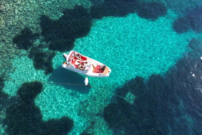 Private boat tour of Red rocks & Pakleni islands - Stop 1: Dubovica Beach and the cave you can explore in shallow water
