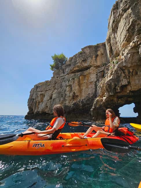 Pula: Cave Kayak Tour, Snorkeling and Island Jumping - The Cave Experience: Pigeons Up Close in Darker Water