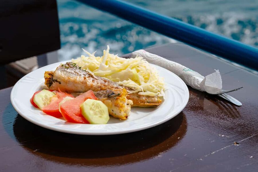 Pula: Private Dolphins & Sunset Tour With Dinner & Drinks - Sunset cruising and the Pula Arena glow at night
