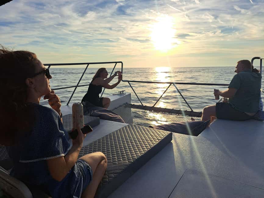 Rovinj: Sunset & dolphin group tours with Catamaran - Sunset to dolphins: how the cruise typically unfolds