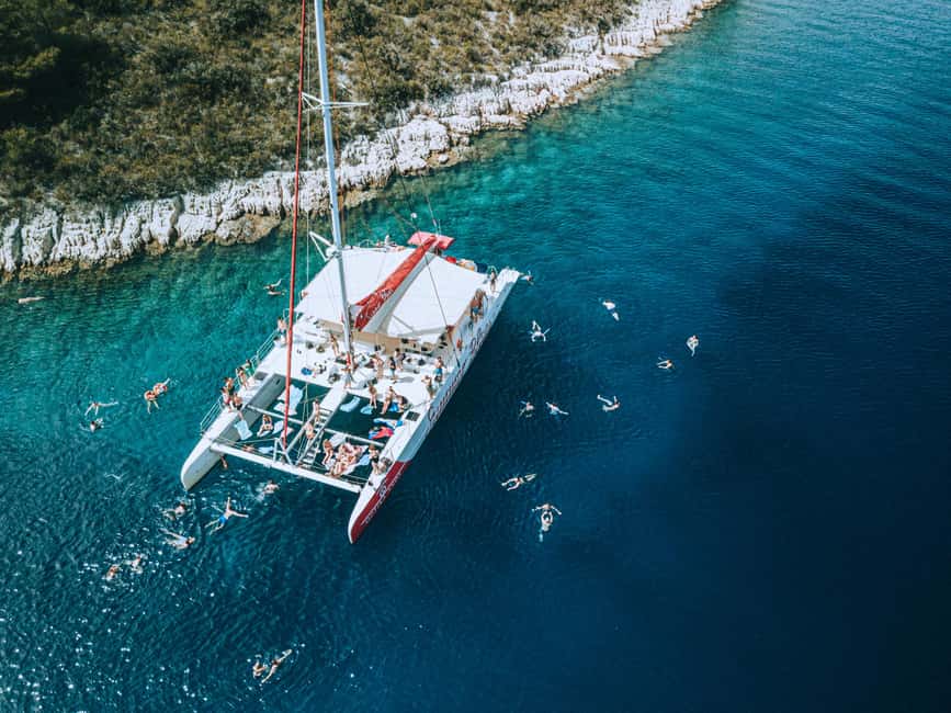 Split: Blue Lagoon & Trogir Boat Tour with Lunch and Drinks - Mega Catamaran Comfort, Wi-Fi, and Unlimited Drinks