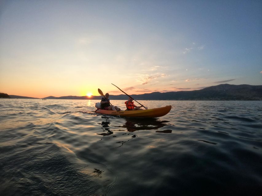 Split: Guided Sunset Sea Kayaking & Snorkeling Tour - The swim, snorkeling break, and cliff-jump moment