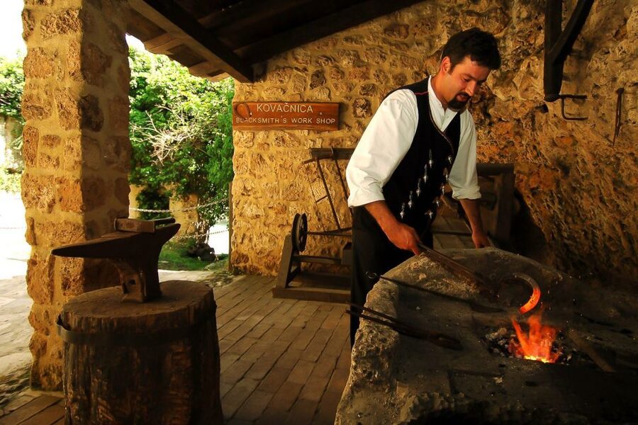 Split & Trogir: Krka Waterfalls & Swimming in Primošten - Primošten: medieval streets, beaches, and the swim you actually planned for