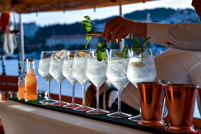 Sunset Cruise | Cocktail Experience on Board around Dubrovnik - City Walls at Dusk: open-air deck views and the first cocktail round