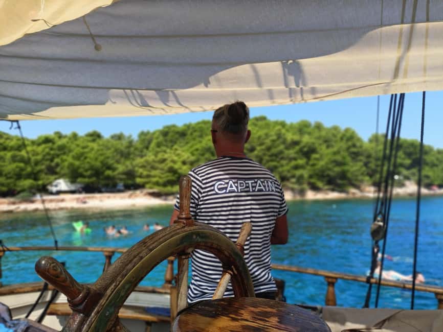 Zadar: Boat Tour with Unlimited Wine & 3 Stops - Stop 3 Kali: Fishing-Village Energy, Beach Views, and Optional Snacks