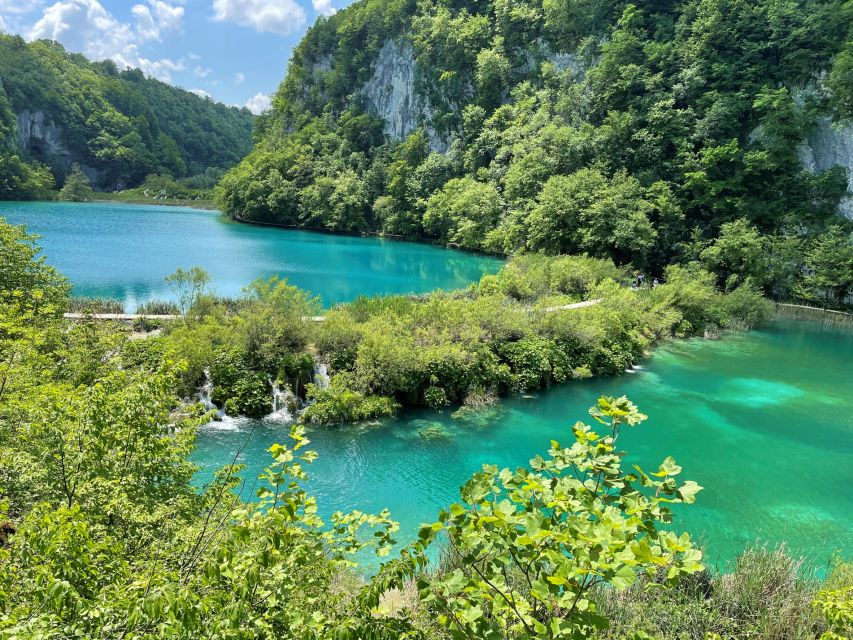 Zagreb: Rastoke & Plitvice Lakes Guided Tour with Ticket - Lake Kozjak boat ride and the in-park train or bus option